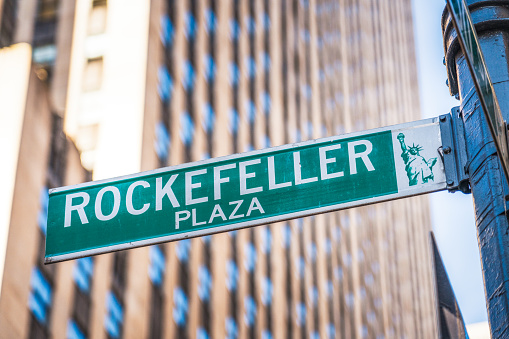 New York City, USA: A street sign for Rockefeller Plaza in front of the Rockefeller Centre in Manhattan.
