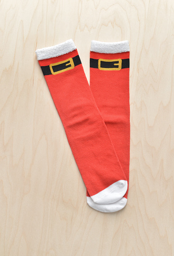 Closeup of a generic, mass produced pair of socks with a Christmas theme.