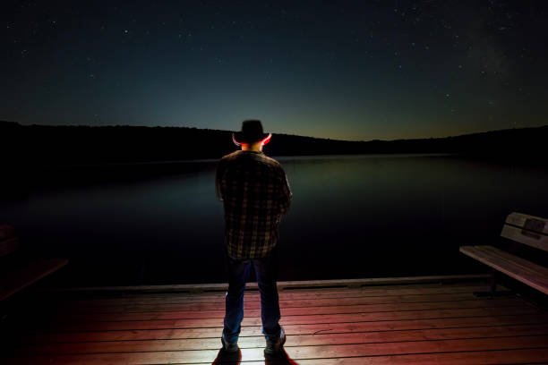 Standing on the docks looking up at the night sky. Standing on the docks looking up at the night sky. stars in your eyes stock pictures, royalty-free photos & images