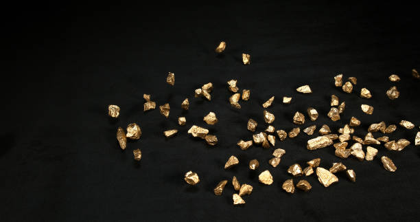 istock Gold Nuggets, Nugget, Falling on Black Background 1689060975