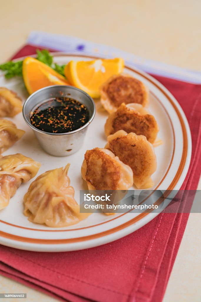 Pork Gyoza With Green Tea Gyoza with pork filling, as well as Asian cabbage, ginger and green onions. Appetizer Stock Photo