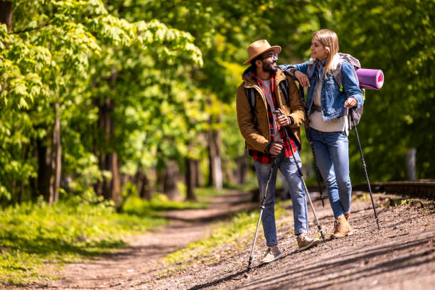 istock Young people having a scandinavian walk in the park 1689065502