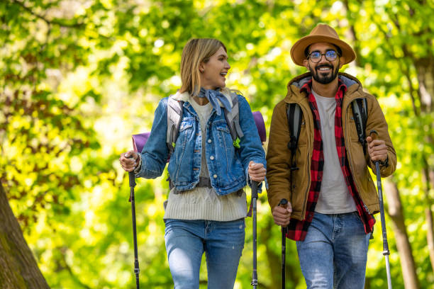 istock Smiling young people with scandinavian sticks in the forest 1689065561