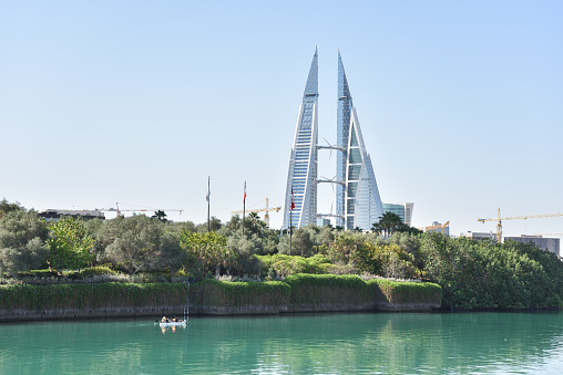Bahrain World Trade Center Twin Towers with Wind Turbines and Kayak in Manama