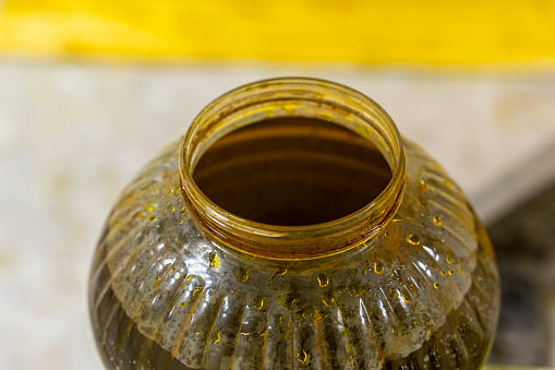 A jar with antiseptic impregnation for wood. Painting of wooden boards with special protective oil. A jar of protective waterproof oil for covering wooden surfaces from bad weather and mold. View from above.