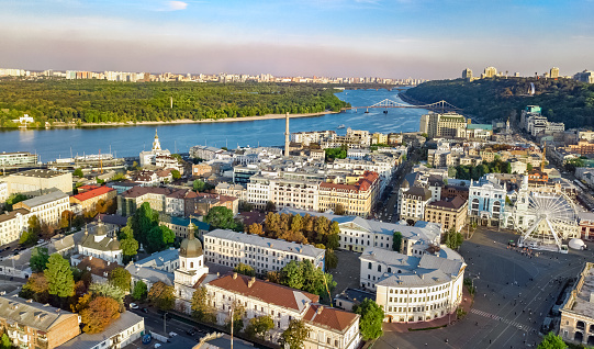 Kyiv cityscape aerial drone view, Dnipro river, downtown and Podol historical district skyline from above, city of Kiev and Dnieper, Ukraine