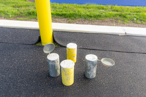 Concrete Test Cylinders on a synthetic turf field construction site.