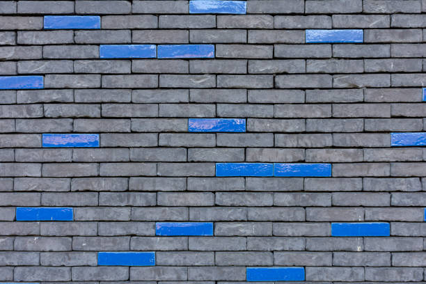 istock Unusual wall of gray and blue bricks 1689077836