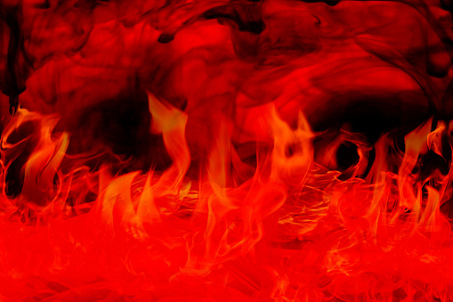 Fire flames on black background. Fantastic chaotic black and red pattern.