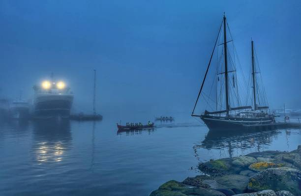 istock Torshavn harbor covered in fog at dusk 1689087912