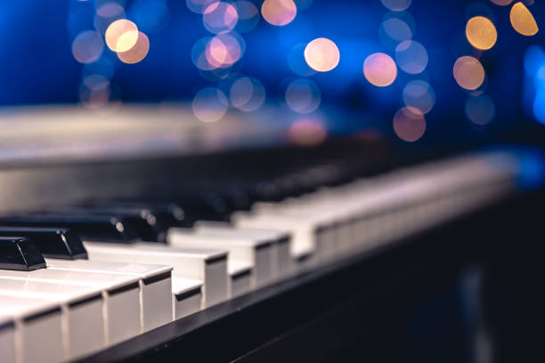 istock Piano keys close-up on a blurred background with bokeh. 1689088114