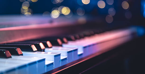 istock Piano keys close-up on a blurred background with bokeh. 1689088122