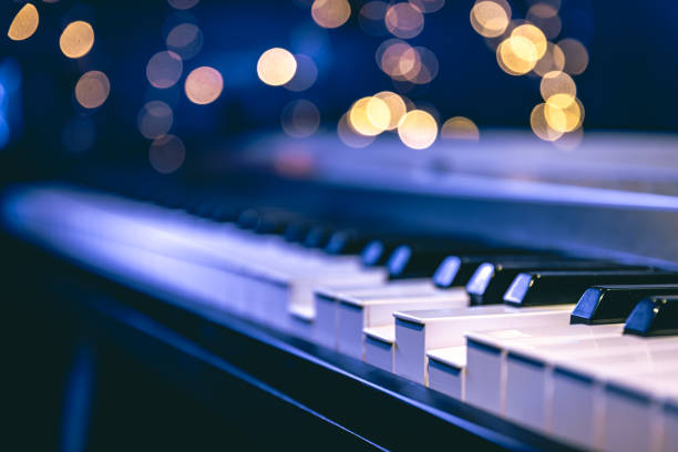 istock Piano keys close-up on a blurred background with bokeh. 1689088130