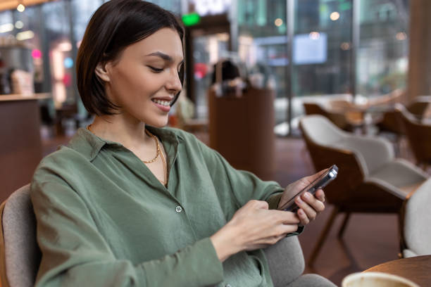 istock Cute girl talking on the phone and looking contented 1689101829