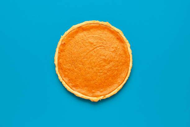 istock Pumpkin pie homemade, minimalist on a blue table 1689109019