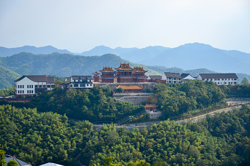 The Daxiangling-Tusita Scenic Area (大香林·兜率天景区) is located in the western end of Huiji Mountain (会稽山) in Keqiao District (柯桥区), Shaoxing City (绍兴市) and covers about 4 square km. It is divided into three realms: Daxiangling, Longhua Temple, and Tusita, also known as the Heavenly Palace. The cylindrical part in the middle of Tusita is the Heavenly Courtyard (or inner courtyard) which enshrines the world's largest indoor seated Buddha, the 33-meter-high Maitreya statue.