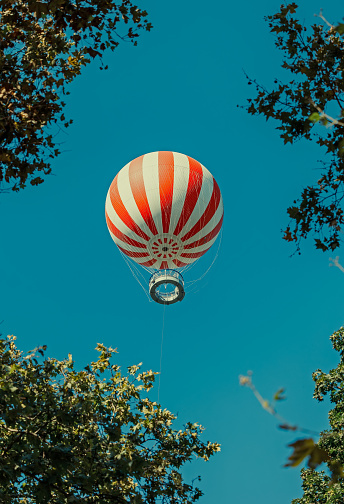 Stripped air ballon fly in blue sky