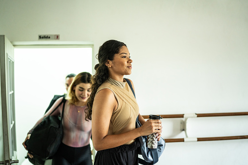 People arriving for dancing ballet class at the dance studio