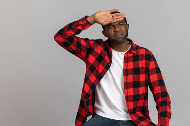 istock Tied sick black bearded man wearing red checkered shirt suffering headache 1689151081