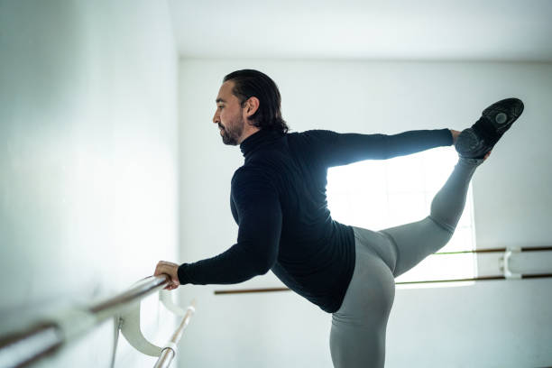 istock Mid adult man stretching at the dance studio 1689154492