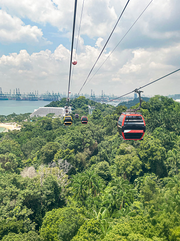 Stock photo showing close-up view of cable car gondolas and cables of the Singapore Cable Car linking Mount Faber, the HarbourFront and Sentosa Island.
