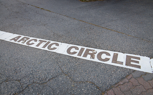 Arctic circle marking line at the floor in Rovaniemi, Finland