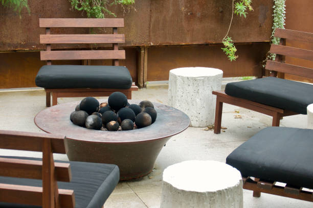 Outdoor Wicker Patio Furniture Couch Ensemble With Zebra Pillows and end tables with fruit and books