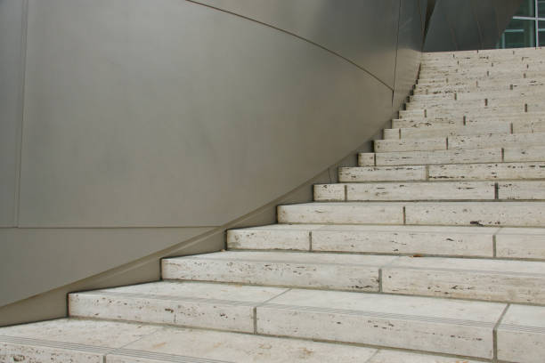 istock Curved grand staircase hugs the smooth wall 1689171421