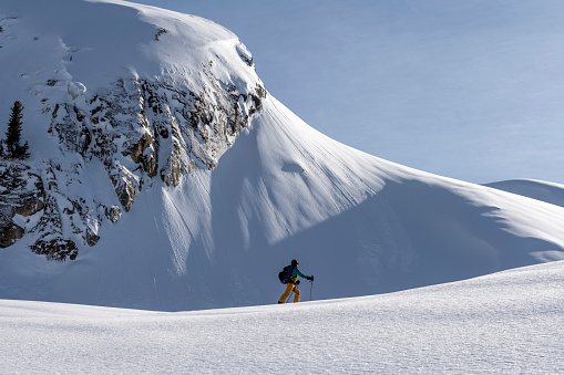 Winter scenery with people skiing at the peak of French alps