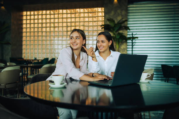 istock Two besties sitting together in a coffee shop 1689210578