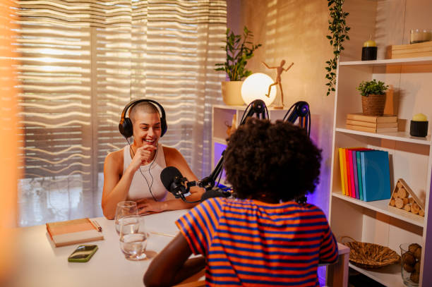 istock Two cheerful girls are making a podcast 1689211114