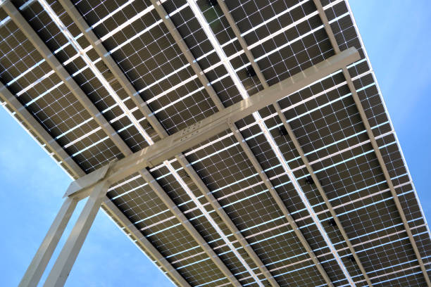 istock Solar panels installed over parking lot canopy shade for parked cars for effective generation of clean energy 1689215938