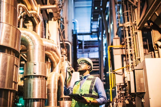 istock Electrical engineer examining Electric Power station using digital tablet and walkie-talkie 1689247609