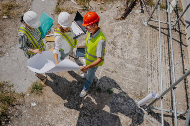 istock Top view of group of engineers on construction site 1689371209