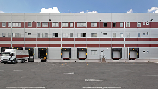Loading Cargo Bay Doors at Distribution Fulfillment Warehouse Building