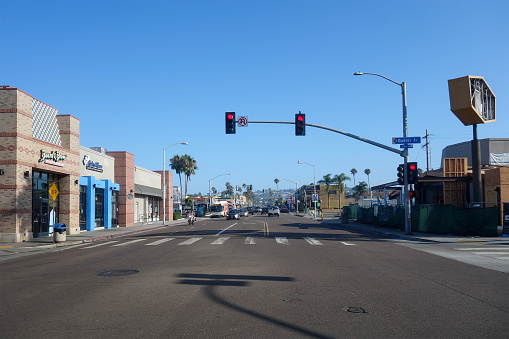 San Diego, CA - August 9, 2022: Busy traffic along Missing Boulevard and Garnet Avenue near historical Crystal Pier at Pacific Beach, San Diego, California