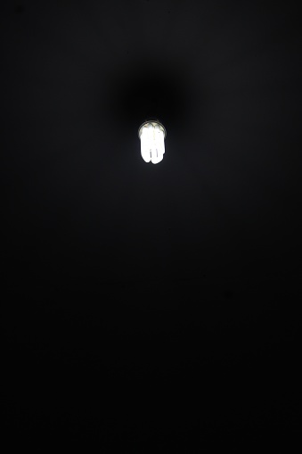 Dim light lamp with dark surroundings
