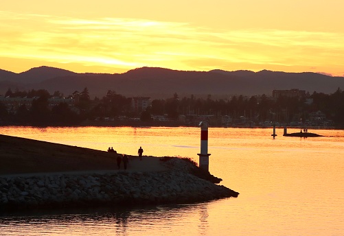 High angle sunset shot of Burrard Inlet and the cityscape of Vancouver, British Columbia, Canada.