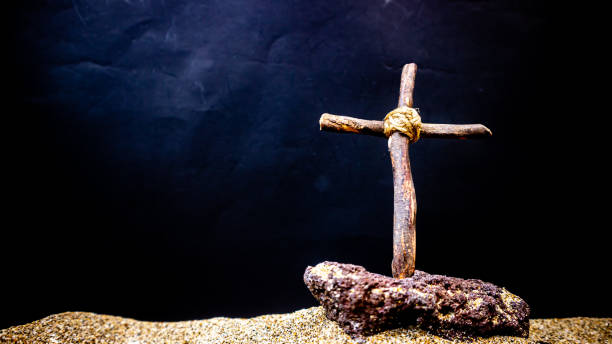 istock wooden cross on black background 1689507783