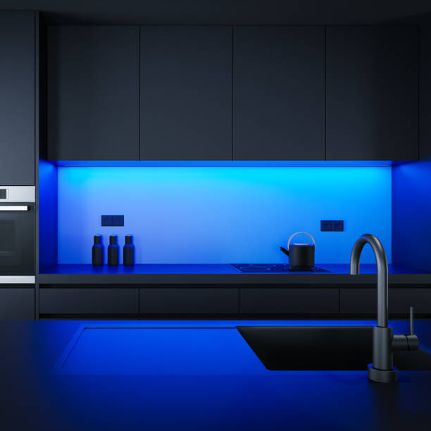 istock Black Modern minimalist kitchen with long island with stools. Dark materials. Blue LED light 1689532586
