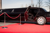 Limo with open door on red carpet