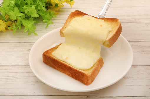 Toast with melted and stretched cheese