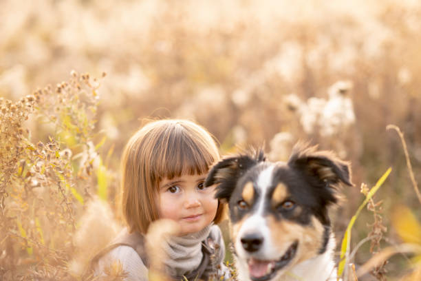Beautiful portrait of a child which embraced her dog
