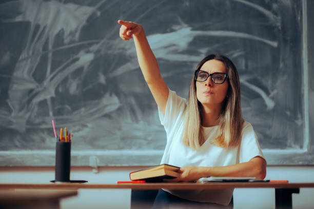 istock Upset Teacher Pointing to a Student in the Classroom 1689623190
