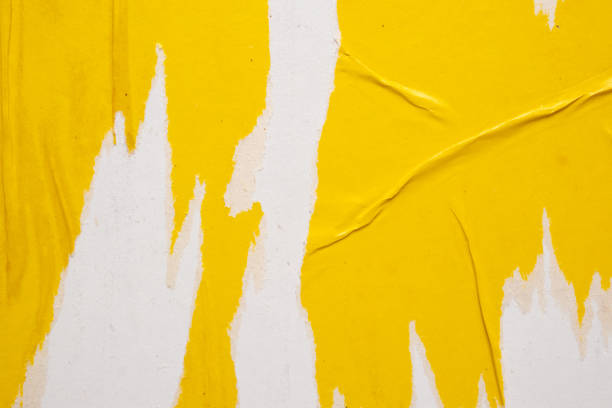 istock Old grunge ripped torn yellow paper poster surface texture background 1689649215