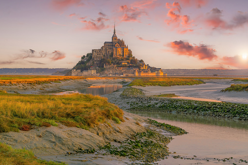 Famous Le Mont Saint-Michel tidal island in Normandy, northern France at sunset
