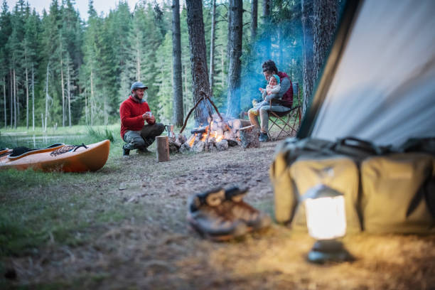 istock Happy family having a peaceful moment around the campfire. 1689651456