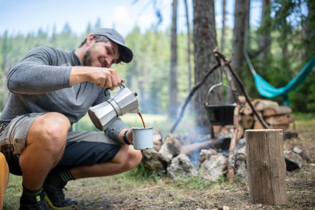 istock Man on camping having freshly brewed coffee in the morning. 1689651483
