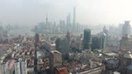 istock Flying over Shanghai towards the financial center with skyscrapers in the Pudong area 1689693143