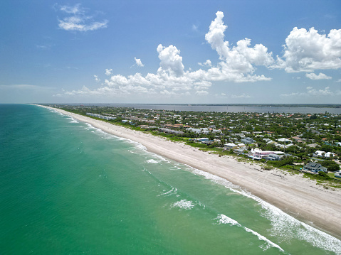 Aerial ocean and beach views on a beautiful sunny Summer day in Melbourne Beach, Florida
